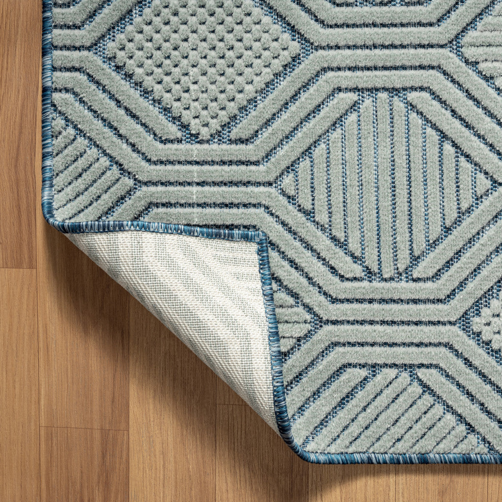 5' X 7' Light Blue And Navy Geometric Stain Resistant Area Rug